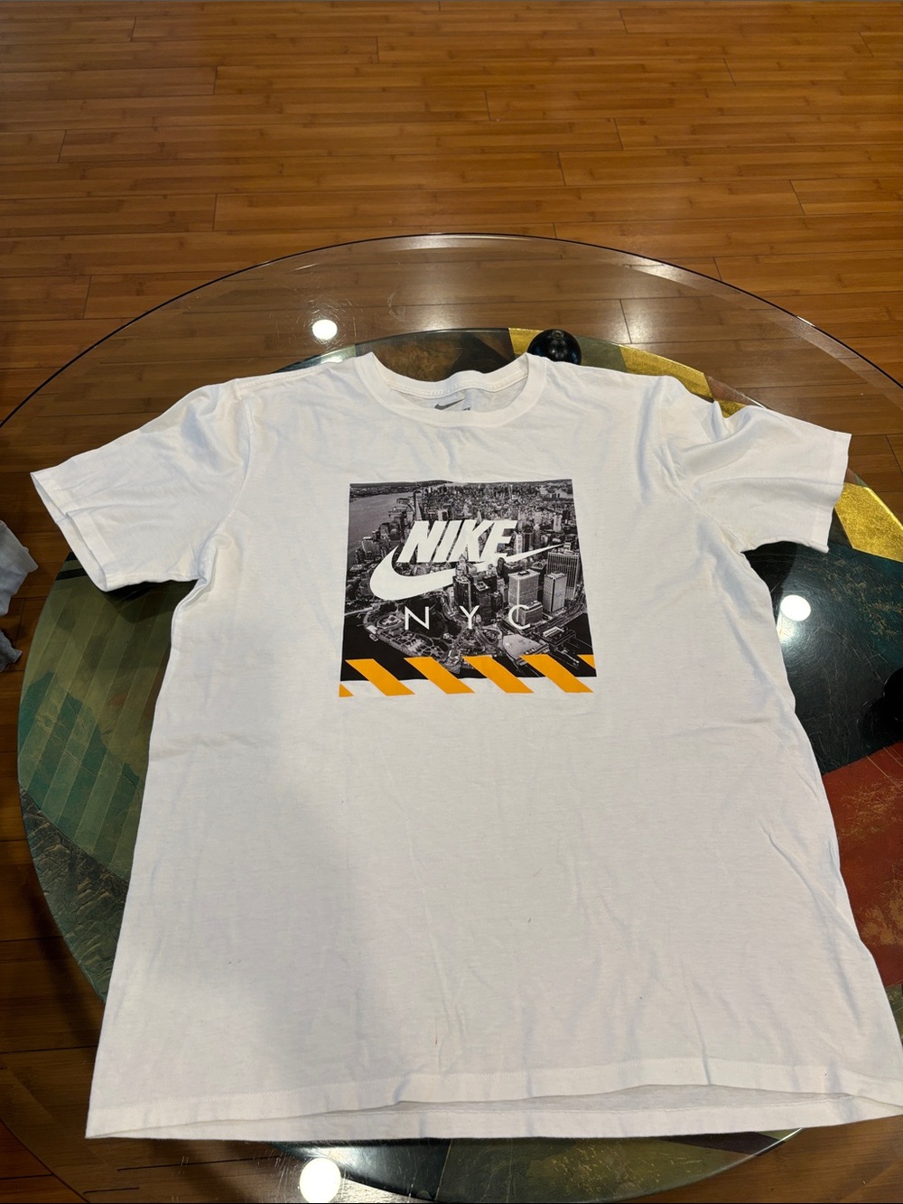 Nike White Short Sleeve Tee with Black NYC Graphic and Yellow Stripe